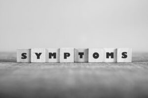 Het woord 'Symptoms' in blokken
